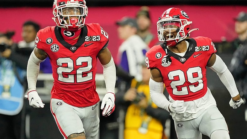 Jan 9, 2023; Inglewood, CA, USA; Georgia Bulldogs defensive back Javon Bullard (22) celebrates with defensive back Christopher Smith (29) after making an interception against the TCU Horned Frogs during the second quarter of the CFP national championship game at SoFi Stadium. Mandatory Credit: Kirby Lee-USA TODAY Sports