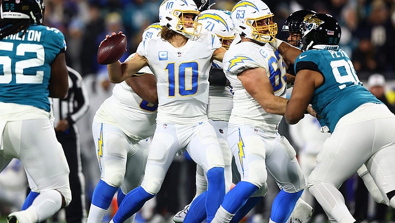 Jan 14, 2023; Jacksonville, Florida, USA; Los Angeles Chargers quarterback Justin Herbert (10) throws during the first quarter of a wild card game against the Jacksonville Jaguars at TIAA Bank Field. Mandatory Credit: Mark J. Rebilas-USA TODAY Sports
