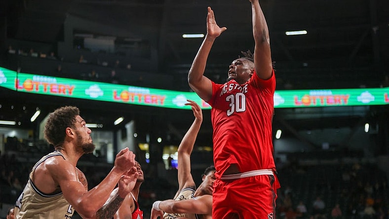 Jan 17, 2023; Atlanta, Georgia, USA; North Carolina State Wolfpack forward D.J. Burns Jr. (30) shoots against the Georgia Tech Yellow Jackets in the first half at McCamish Pavilion. Mandatory Credit: Brett Davis-USA TODAY Sports