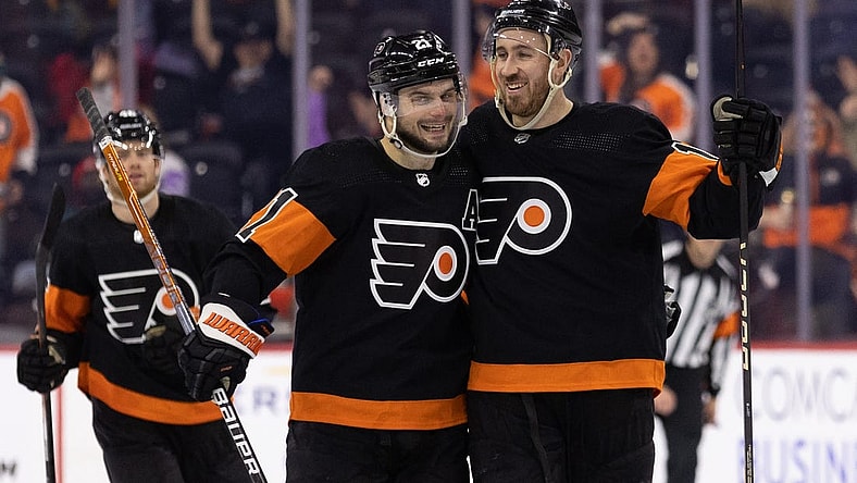 Jan 17, 2023; Philadelphia, Pennsylvania, USA; Philadelphia Flyers center Kevin Hayes (13) celebrates with center Scott Laughton (21) after scoring a goal for a hat trick against the Anaheim Ducks during the third period at Wells Fargo Center. Mandatory Credit: Bill Streicher-USA TODAY Sports