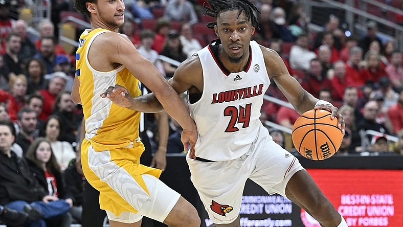 Jan 18, 2023; Louisville, Kentucky, USA;  Louisville Cardinals forward Jae'Lyn Withers (24) dribbles against Pittsburgh Panthers forward Nate Santos (5) during the second half at KFC Yum! Center. Pittsburg defeated Louisville 75-54. Mandatory Credit: Jamie Rhodes-USA TODAY Sports