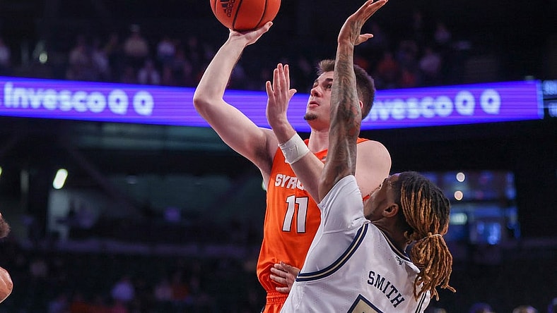Jan 21, 2023; Atlanta, Georgia, USA; Syracuse Orange guard Joseph Girard III (11) shoots past Georgia Tech Yellow Jackets guard Deivon Smith (5) in the first half at McCamish Pavilion. Mandatory Credit: Brett Davis-USA TODAY Sports