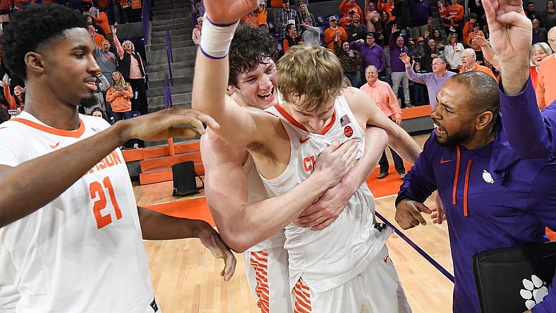 January 21, 2023; Clemson, SC; Clemson sophomore forward PJ Hall (24) hugs forward Hunter Tyson (5) near freshman forward Chauncey Wiggins (21) after the Tigers beat Virginia Tech at Littlejohn Coliseum in Clemson, S.C. Saturday, January 21, 2023. Hunter made the go-ahead three-point shot and rebound in the end helping the Tigers win 51-50. Hall led the Tigers with 20 points.  Mandatory Credit: Ken Ruinard-USA TODAY NETWORK