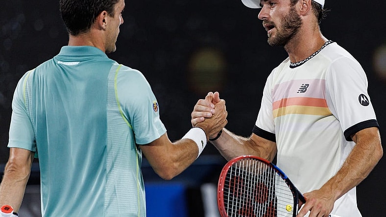 Jan 23, 2023; Melbourne, Victoria, Australia; Tommy Paul of the United States shakes hands with Roberto Bautista-Agut of Spain after beating him on day eight of the 2023 Australian Open tennis tournament at Melbourne Park. Mandatory Credit: Mike Frey-USA TODAY Sports