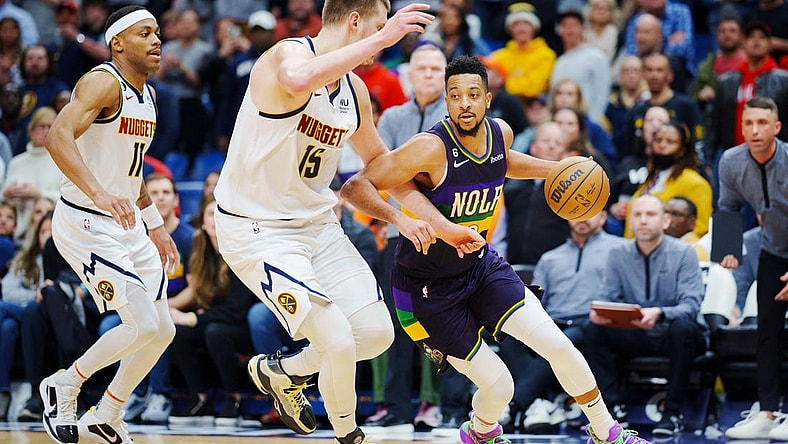 Jan 24, 2023; New Orleans, Louisiana, USA; New Orleans Pelicans guard CJ McCollum (3) fights for position against Denver Nuggets center Nikola Jokic (15) during the fourth quarter at Smoothie King Center. Mandatory Credit: Andrew Wevers-USA TODAY Sports