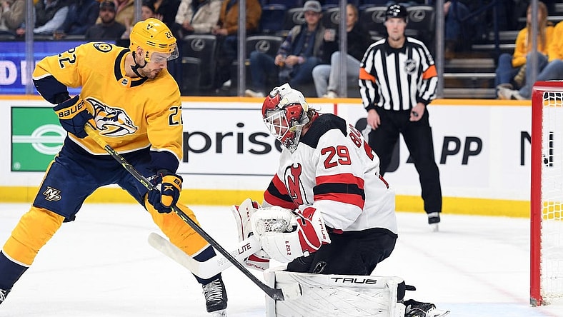 Jan 26, 2023; Nashville, Tennessee, USA; Nashville Predators right wing Nino Niederreiter (22) has a shot blocked by New Jersey Devils goaltender Mackenzie Blackwood (29) during the first period at Bridgestone Arena. Mandatory Credit: Christopher Hanewinckel-USA TODAY Sports
