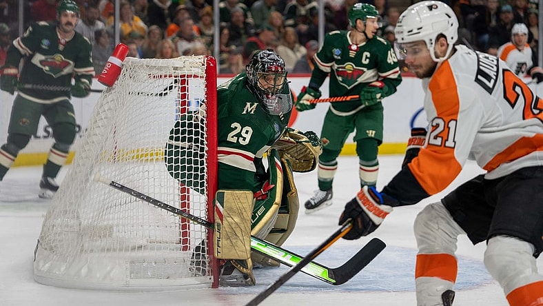 Jan 26, 2023; Saint Paul, Minnesota, USA; Philadelphia Flyers center Scott Laughton (21) rebounds as Minnesota Wild goaltender Marc-Andre Fleury (29) defends in the first period at Xcel Energy Center. Mandatory Credit: Matt Blewett-USA TODAY Sports