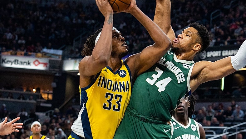 Jan 27, 2023; Indianapolis, Indiana, USA; Indiana Pacers center Myles Turner (33) shoots the ball while Milwaukee Bucks forward Giannis Antetokounmpo (34) defends in the first quarter at Gainbridge Fieldhouse. Mandatory Credit: Trevor Ruszkowski-USA TODAY Sports