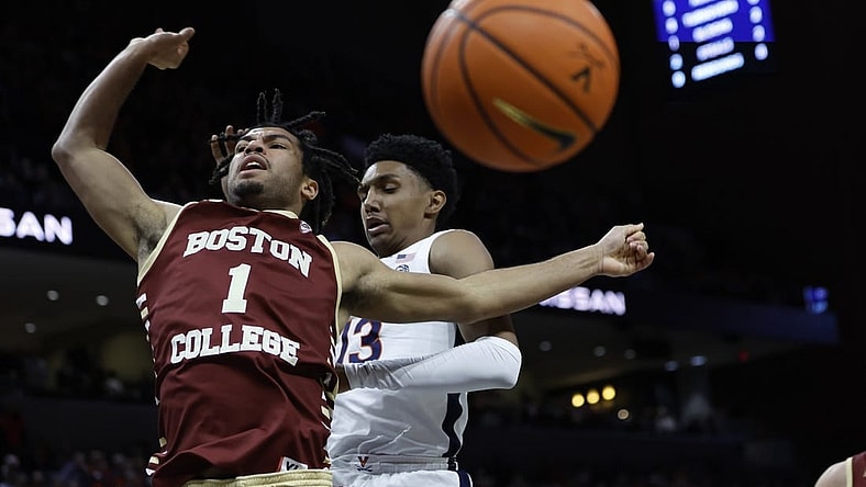Jan 28, 2023; Charlottesville, Virginia, USA; Virginia Cavaliers guard Ryan Dunn (13) blocks the shot of Boston College Eagles forward T.J. Bickerstaff (1) in the first half at John Paul Jones Arena. Mandatory Credit: Geoff Burke-USA TODAY Sports