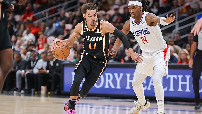 Jan 28, 2023; Atlanta, Georgia, USA; Atlanta Hawks guard Trae Young (11) drives on LA Clippers guard Terance Mann (14) in the first quarter at State Farm Arena. Mandatory Credit: Brett Davis-USA TODAY Sports