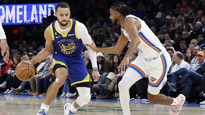 Jan 30, 2023; Oklahoma City, Oklahoma, USA; Golden State Warriors guard Stephen Curry (30) dribbles the ball down the court against Oklahoma City Thunder guard Isaiah Joe (11) during the second quarter at Paycom Center. Mandatory Credit: Alonzo Adams-USA TODAY Sports