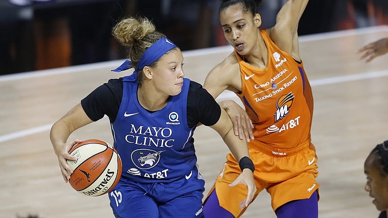 Sep 17, 2020; Palmetto, Florida, USA; Phoenix Mercury guard Skylar Diggins-Smith (right) guards against Minnesota Lynx guard Rachel Banham (15) during the second half at the FELD entertainment complex. Mandatory Credit: Reinhold Matay-USA TODAY Sports