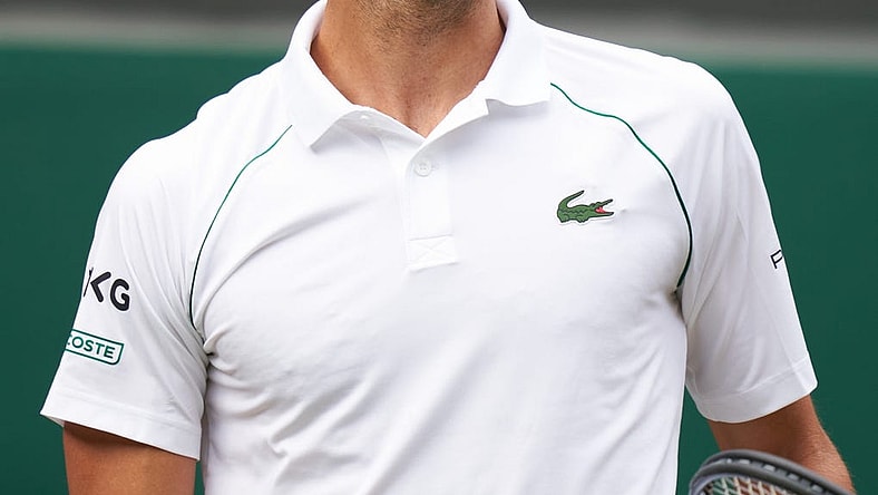 Jul 11, 2021; London, United Kingdom; Novak Djokovic (SRB) smiling while playing against Matteo Berrettini (ITA) in the men s final on Centre Court at All England Lawn Tennis and Croquet Club. Mandatory Credit: Peter van den Berg-USA TODAY Sports