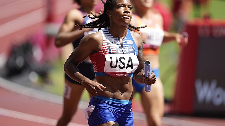 Aug 5, 2021; Tokyo, Japan; Aleia Hobbs (USA) crosses the finish line after competing in the women's 4x100m relay round 1 heat 1 during the Tokyo 2020 Summer Olympic Games at Olympic Stadium. Mandatory Credit: Andrew Nelles-USA TODAY Sports