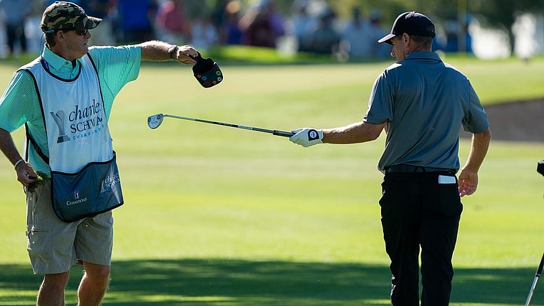 Nov 12, 2021; Phoenix, Arizona, USA; Steven Alker (right) and caddy Sam Workman (left) trade out clubs after hitting to the green of the ninth during the second round of the Charles Schwab Cup Championship golf tournament at Phoenix Country Club. Mandatory Credit: Allan Henry-USA TODAY Sports