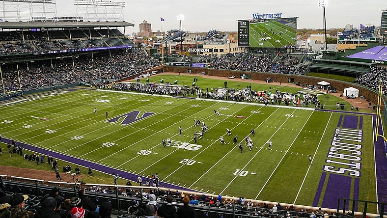 Nov 20, 2021; Chicago, Illinois, USA; A general view as Purdue Boilermakers punter Jack Ansell (30) punts the ball against the Northwestern Wildcats during the first quarter at Wrigley Field. Mandatory Credit: Jon Durr-USA TODAY Sports