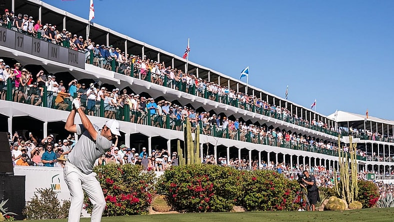 Scottie Scheffler plays hit tee shot on the par 3 16th hole during the final round of the WM Phoenix Open golf tournament. Mandatory Credit: Allan Henry-USA TODAY Sports