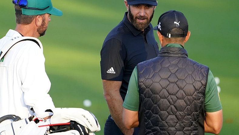 Apr 5, 2022; Augusta, Georgia, USA; Dustin Johnson hits at the practice facility during a practice round of The Masters golf tournament at Augusta National Golf Club. Mandatory Credit: Danielle Parhizkaran-Augusta Chronicle/USA TODAY Network

Golf Masters Tournament Practice Round