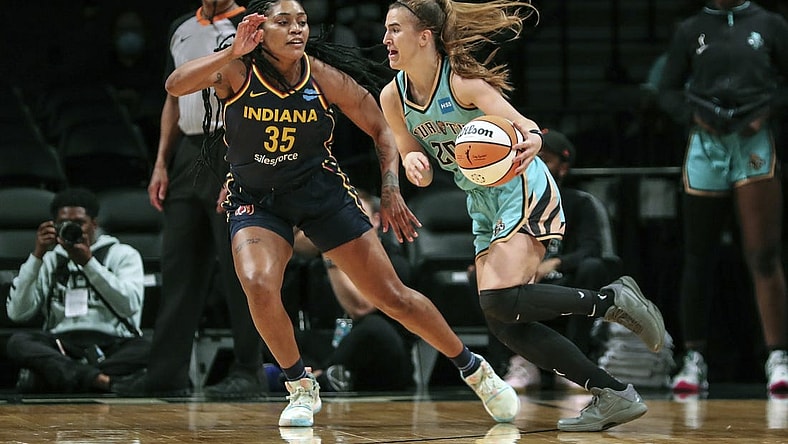 Jun 1, 2022; Brooklyn, New York, USA; New York Liberty guard Sabrina Ionescu (20) drives past Indiana Fever guard Victoria Vivians (35) in the first quarter at Barclays Center. Mandatory Credit: Wendell Cruz-USA TODAY Sports