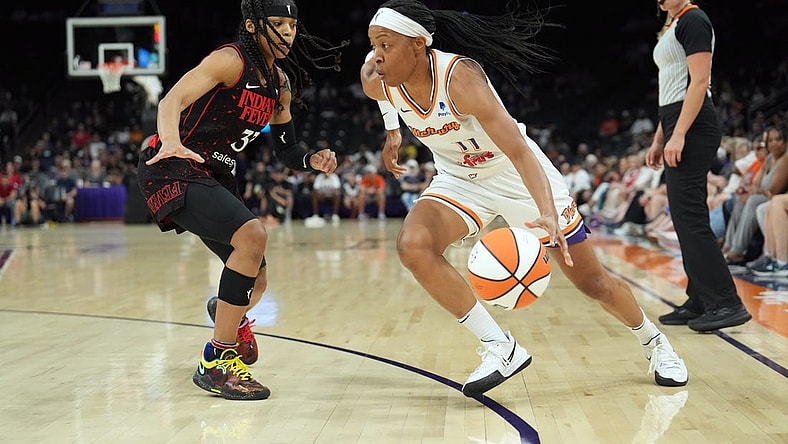 Jun 29, 2022; Phoenix, Arizona, USA; Phoenix Mercury guard Shey Peddy (11) dribbles against Indiana Fever guard Destanni Henderson (33) during the first half at Footprint Center. Mandatory Credit: Joe Camporeale-USA TODAY Sports