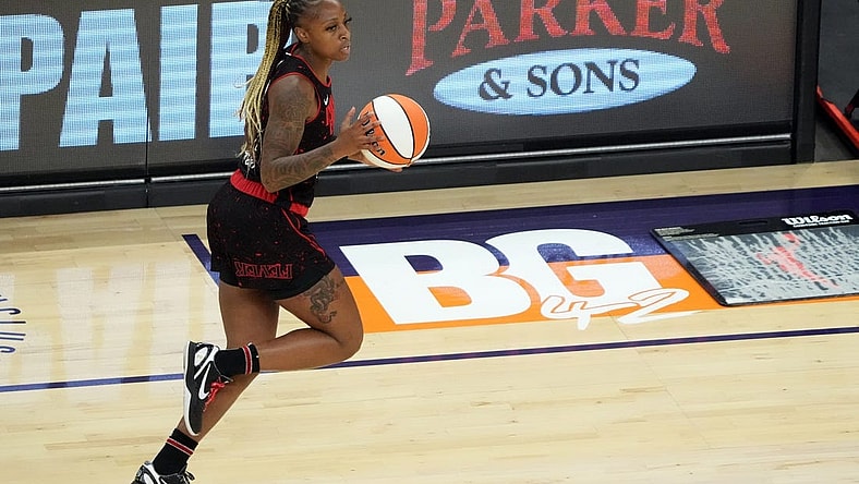 Jun 29, 2022; Phoenix, Arizona, USA; Indiana Fever guard Tiffany Mitchell (25) dribbles by a painted section of the court reading BG 42 in support of Phoenix Mercury center Brittney Griner (not pictured) during the first half at Footprint Center. Mandatory Credit: Joe Camporeale-USA TODAY Sports