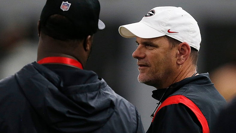 Georgia football analyst Mike Bobo speaks with an NFL scout during Georgia's Pro Day in Athens, Ga., on Wednesday, March 16, 2022.

Syndication Online Athens