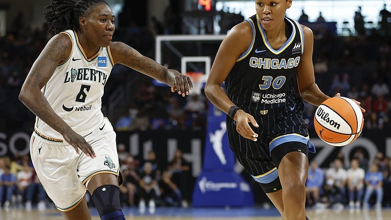 Aug 20, 2022; Chicago, Illinois, USA; Chicago Sky forward Azura Stevens (30) drives to the basket against New York Liberty forward Natasha Howard (6) during the first half of Game 2 of the first round of the WNBA playoffs at Wintrust Arena. Mandatory Credit: Kamil Krzaczynski-USA TODAY Sports