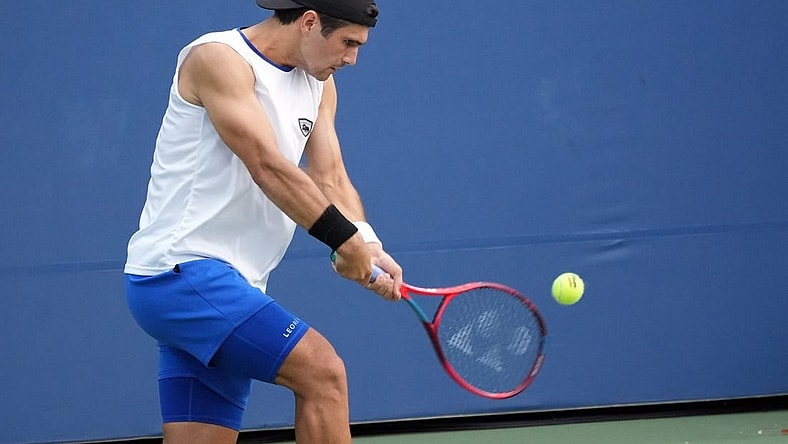 Aug 30, 2022; Flushing, NY, USA; Marcos Giron of the United States hits a shot against Frances Tiafoe of the United States on day two of the 2022 U.S. Open tennis tournament at USTA Billie Jean King National Tennis Center. Mandatory Credit: Jerry Lai-USA TODAY Sports