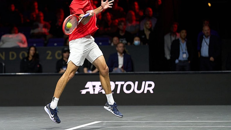 Sep 24, 2022; London, United Kingdom;
Taylor Fritz (USA) plays a shot against Cameron Norrie (GBR) in a Laver Cup singles match. Mandatory Credit: Peter van den Berg-USA TODAY Sports