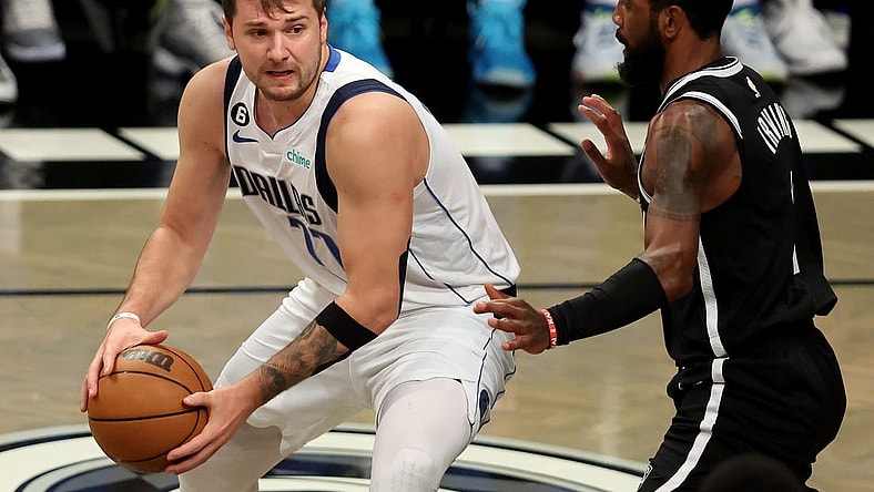 Oct 27, 2022; Brooklyn, New York, USA; Dallas Mavericks guard Luka Doncic (77) controls the ball against Brooklyn Nets guard Kyrie Irving (11) during the first quarter at Barclays Center. Mandatory Credit: Brad Penner-USA TODAY Sports