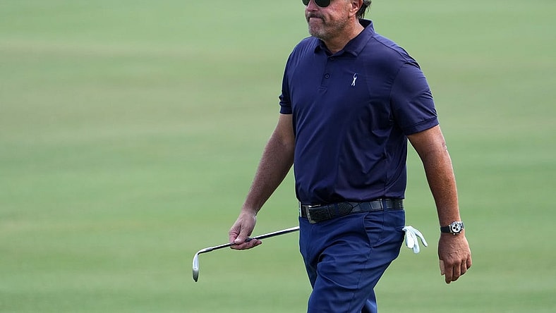 Oct 28, 2022; Miami, Florida, USA; Phil Mickelson walks up the fairway of the first hole during the first round of the season finale of the LIV Golf series at Trump National Doral. Mandatory Credit: Jasen Vinlove-USA TODAY Sports