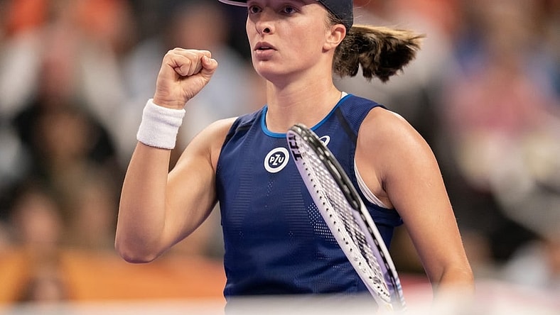 Nov 5, 2022; Forth Worth, TX, USA; Iga Swiatek (POL) reacts after a point against Coco Gauff (USA) during a match on day six of the WTA Finals at Dickies Arena. Mandatory Credit: Susan Mullane-USA TODAY Sports