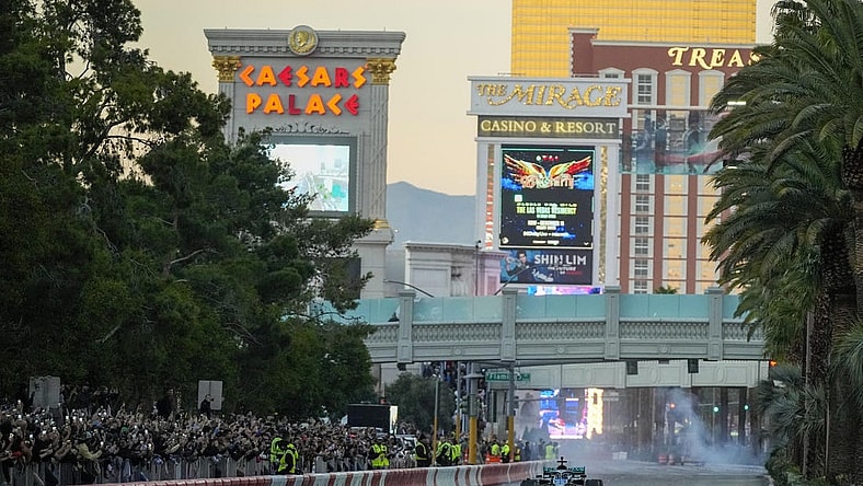 Nov 5, 2022; Las Vegas, Nevada, USA;  Mercedes-AMG Petronas driver George Russell drives on the track during the Formula One Las Vegas Grand Prix Launch Party at Las Vegas Strip. Mandatory Credit: Ray Acevedo-USA TODAY Sports