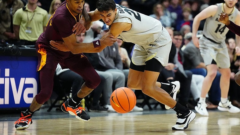 Dec 1, 2022; Boulder, Colorado, USA; Colorado Buffaloes forward Tristan da Silva (23) and Arizona State Sun Devils guard Desmond Cambridge Jr. (4) reach for a loose ball in the second half at the CU Events Center. Mandatory Credit: Ron Chenoy-USA TODAY Sports