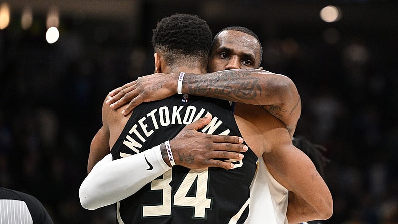 Dec 2, 2022; Milwaukee, Wisconsin, USA; Los Angeles Lakers forward LeBron James (6) and Milwaukee Bucks forward Giannis Antetokounmpo (34) exchange hugs after the Los Angeles Lakers 133-129 win over the Milwaukee Bucks at Fiserv Forum. Mandatory Credit: Michael McLoone-USA TODAY Sports