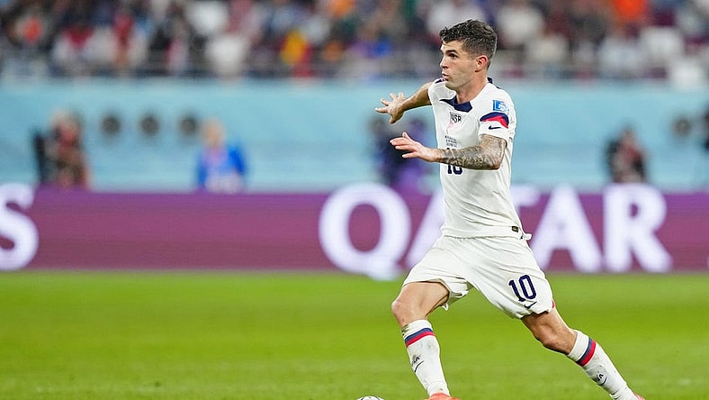 Dec 3, 2022; Al Rayyan, Qatar; United States of America forward Christian Pulisic (10) dribbles the ball against the Netherlands during the second half of a round of sixteen match in the 2022 FIFA World Cup at Khalifa International Stadium. Mandatory Credit: Danielle Parhizkaran-USA TODAY Sports