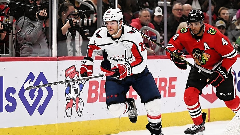 Dec 13, 2022; Chicago, Illinois, USA;  Washington Capitals forward Nic Dowd (26) skates against the Chicago Blackhawks at United Center. Mandatory Credit: Jamie Sabau-USA TODAY Sports