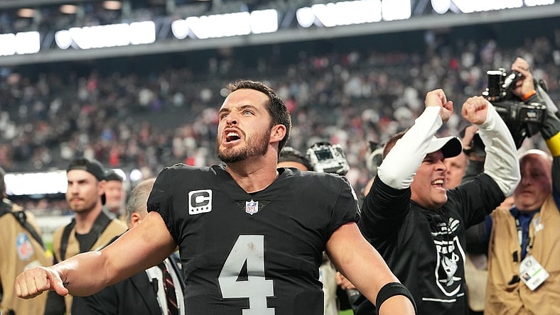 Dec 18, 2022; Paradise, Nevada, USA; Las Vegas Raiders quarterback Derek Carr (4) and Raiders head coach Josh McDaniels celebrate after the Raiders defeated the New England Patriots 30-24 at Allegiant Stadium. Mandatory Credit: Stephen R. Sylvanie-USA TODAY Sports