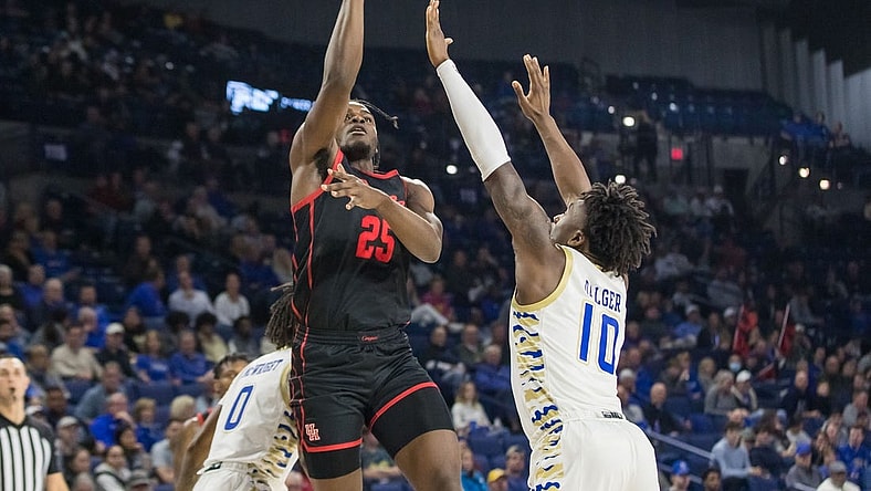 Dec 28, 2022; Tulsa, Oklahoma, USA; Houston Cougars forward Jarace Walker (25) shoots over Tulsa Golden Hurricane forward Tim Dalger (10) during the second half at Reynolds Center. Houston won 89 - 50. Mandatory Credit: Brett Rojo-USA TODAY Sports