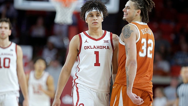 Texas Longhorns forward Christian Bishop (32) smiles as he walks past Oklahoma Sooners forward Jalen Hill (1) during an NCAA men's college basketball game between the University of Oklahoma and Texas at Lloyd Noble Center in Norman, Okla., Saturday, Dec. 31, 2022. Texas won 70-69.
Oklahoma Vs Texas Basketball