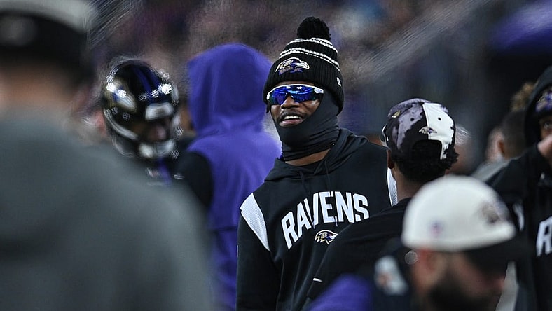 Jan 1, 2023; Baltimore, Maryland, USA;  Baltimore Ravens quarterback Lamar Jackson (8) stands on the sidelines during the second  half against the Pittsburgh Steelers at M&T Bank Stadium. Mandatory Credit: Tommy Gilligan-USA TODAY Sports