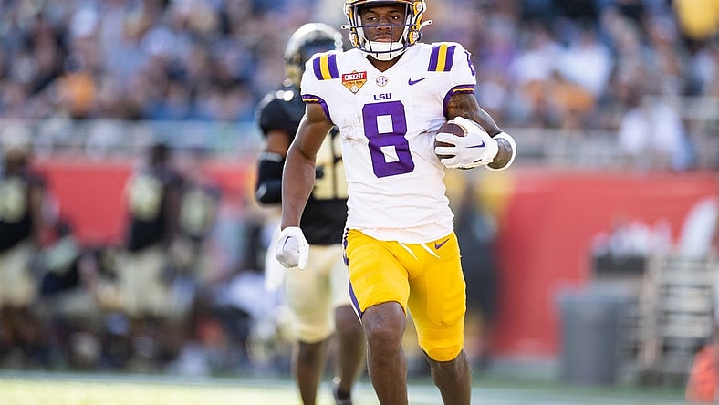 Jan 2, 2023; Orlando, FL, USA; LSU Tigers wide receiver Malik Nabers (8) rushes with the ball for a touchdown during the second half against the Purdue Boilermakers at Camping World Stadium. Mandatory Credit: Matt Pendleton-USA TODAY Sports