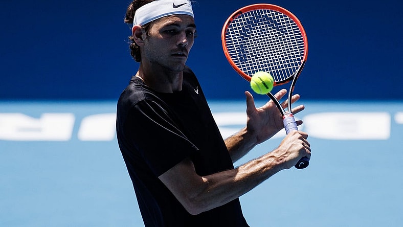 Jan 13, 2023; Melbourne, Victoria, Australia; Taylor Fritz of the United States hits a shot during a practice session on Margaret Court Arena at Melbourne Park. Mandatory Credit: Mike Frey-USA TODAY Sports