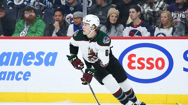 Jan 15, 2023; Winnipeg, Manitoba, CAN;  Arizona Coyotes defenseman Jakob Chychrun (6) looks to make a pass against the Winnipeg Jets during the second period at Canada Life Centre. Mandatory Credit: Terrence Lee-USA TODAY Sports