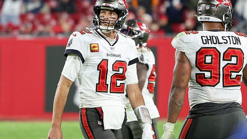 Jan 16, 2023; Tampa, Florida, USA; Tampa Bay Buccaneers quarterback Tom Brady (12) walks off the field in the final minute against the Dallas Cowboys in the fourth quarter during a wild card game at Raymond James Stadium. Mandatory Credit: Nathan Ray Seebeck-USA TODAY Sports
