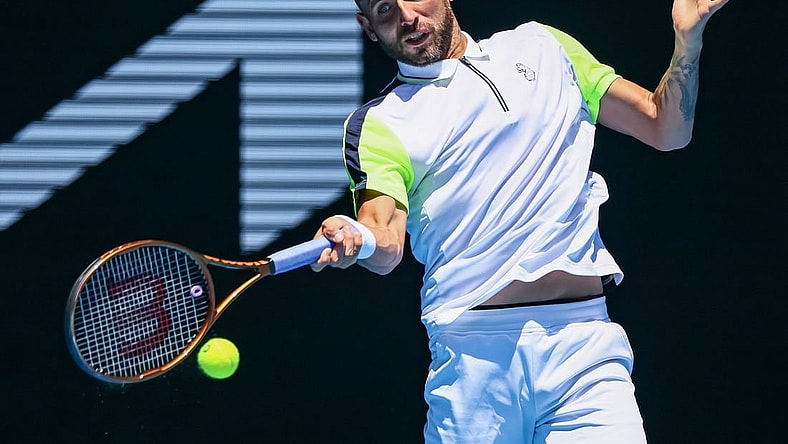 Jan 21, 2023; Melbourne, VICTORIA, Australia; Daniel Evans from Great Britain during his third round match against Andrey Rublev from Russia on day six of the 2023 Australian Open tennis tournament at Melbourne Park. Mandatory Credit: Mike Frey-USA TODAY Sports