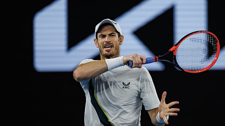 Jan 21, 2023; Melbourne, Victoria, Australia;   Andy Murray of Great Britain hits a forehand against Roberto Bautista-Agut of Spain on day six of the 2023 Australian Open tennis tournament at Melbourne Park. Mandatory Credit: Mike Frey-USA TODAY Sports