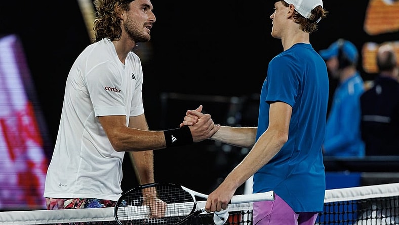 Jan 22, 2023; Melbourne, Victoria, Australia;  Stefanos Tsitsipas of Greece shakes hands with Jannik Sinner of Italy after beating him on day seven of the 2023 Australian Open tennis tournament at Melbourne Park. Mandatory Credit: Mike Frey-USA TODAY Sports