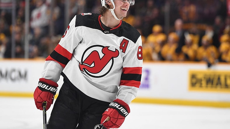 Jan 26, 2023; Nashville, Tennessee, USA; New Jersey Devils center Jack Hughes (86) celebrate after a goal during the second period against the Nashville Predators at Bridgestone Arena. Mandatory Credit: Christopher Hanewinckel-USA TODAY Sports