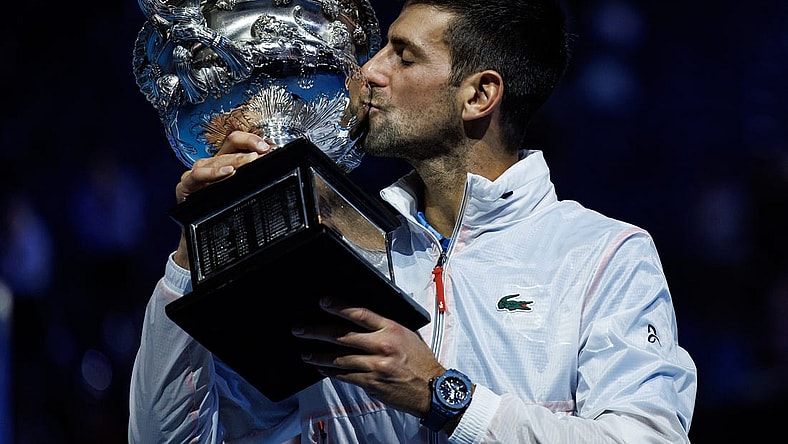 Jan 29, 2023; Melbourne, Victoria, Australia; Novak Djokovic of Serbia poses with the trophy after beating Stefanos Tsitsipas of Greece in the men's final on day fourteen of the 2023 Australian Open tennis tournament at Melbourne Park. Mandatory Credit: Mike Frey-USA TODAY Sports
